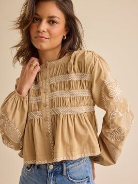 Embroidered peplum blouse